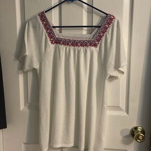 White blouse with red and blue accents